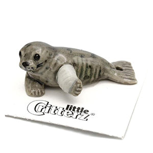 Porcelain figurine of a rescued harbor seal pup
