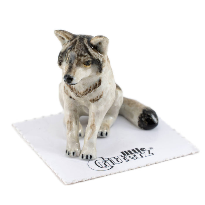 Wolf Sitting "Akela" - miniature porcelain figurine
